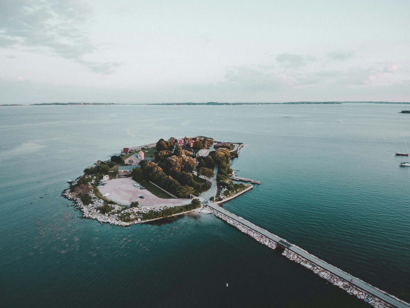 Discover the tranquil beauty of a picturesque coastal island surrounded by blue waters.